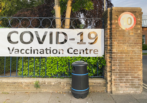 A large sign display the words Covid-19 Vaccination Centre