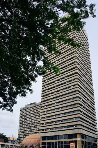 Abidjan, Ivory Coast / Côte d'Ivoire: Cité Financiére / Financial City building -  Ministry of Finance tower housing several finance departments (budget, tax authorities, treasury), located on Boulevard Clozel, in the administrative district of the Plateau.