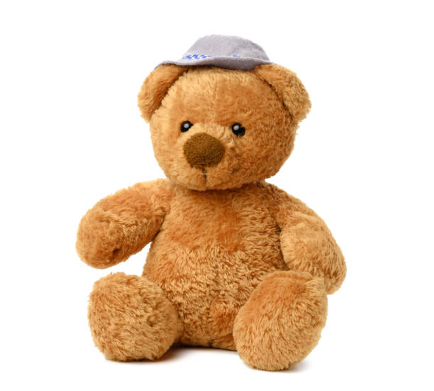 Young girl hugging her teddy bear.