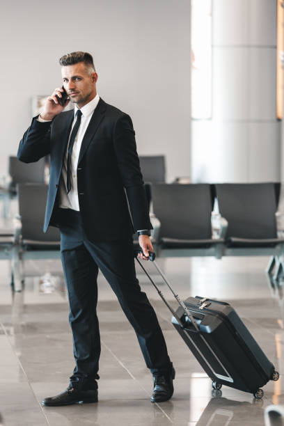 istock Handsome mature businessman talking on mobile phone 1323857657