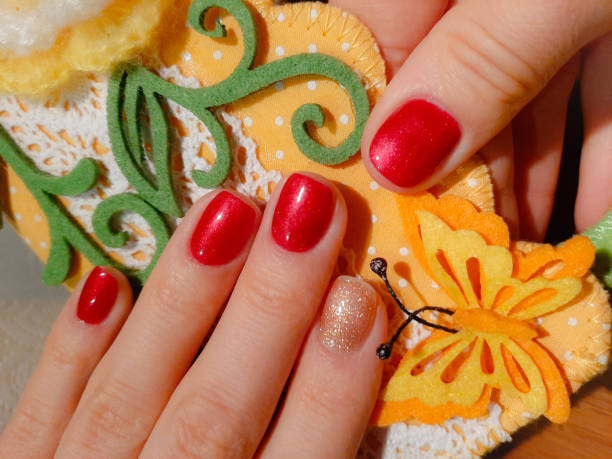 istock Beautiful nail design red gold 1323859302