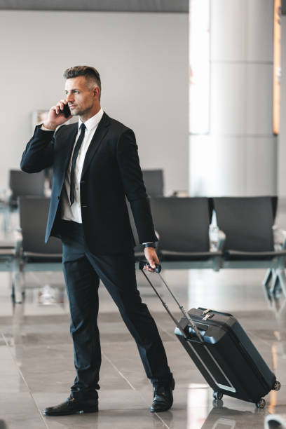 istock Confident mature businessman talking on mobile phone 1323859625