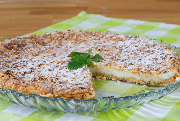 istock Yogurt pie from sprinkled dough with mint leaf on a tray 1323861839