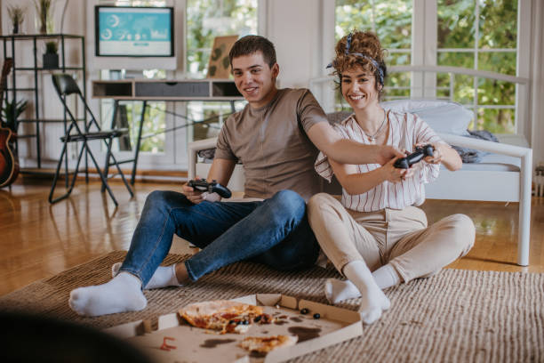 istock Couple playing video games 1323863444