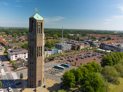 Aerial view on the Poldertoren old water tower in the town Emmeloord in the Noordoostpolder, Flevoland, The Netherlands, located in the town’s center and the middle point of the Noordoostpolder. The Noordoostpolder is a polder in the former Zuiderzee designed initially to create more agricultural land.