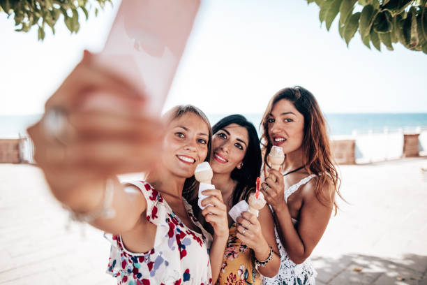 istock friends take a selfie with the ice cream 1323866237