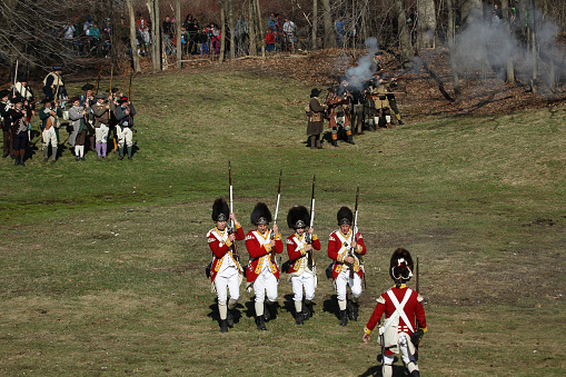 Memorial Day Celebration - Parker Revenge Battle Demonstration held in Lexington, MA on Sunday, April 20, 2014.Hundreds of British and Colonial Re-enactors engaged in a tactical weapons demonstration showing the running battle that took place along this deadly stretch of road on the border of Lincoln and Lexington on April 19, 1775.