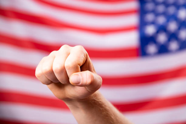 istock American flag with fist 1323869734