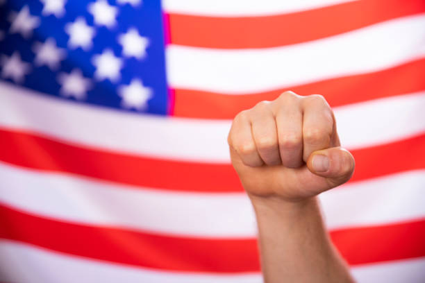 istock American flag with fist 1323869763