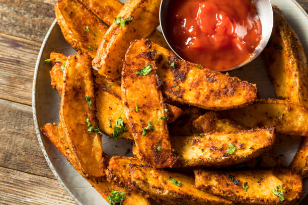 istock Homemade Spicy Oven Fried Potato Wedges 1323872231