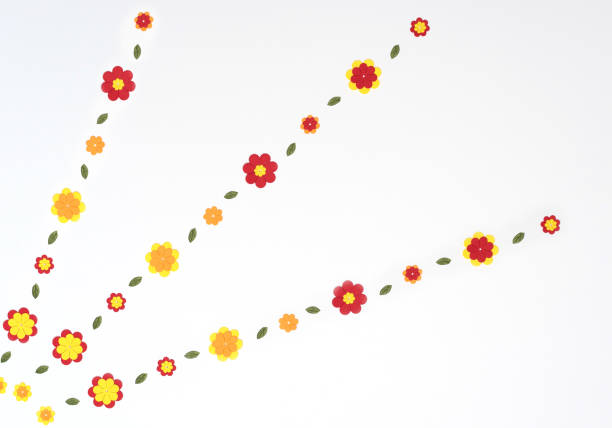 istock Bright red, yellow, orange paper flowers on white background. Spring, summer concept. Flat lay style with copy space 1323876707