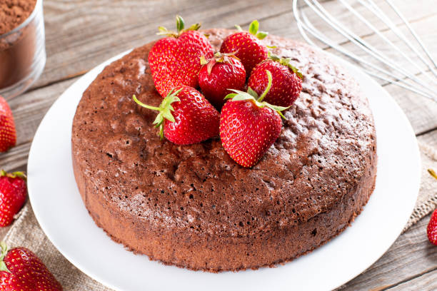 istock Fresh chocolate sponge cake with strawberry. Chiffon biscuit for cake 1323883409