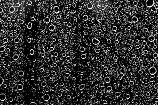 istock Water drops on glass black and white 1323884848