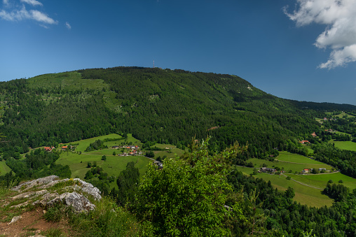 Schockl hill and Ehrenfels castle near Sankt Radegund town in summer color fresh morning