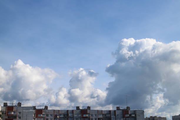 istock Large cumulus clouds on the blue sky 1323888743