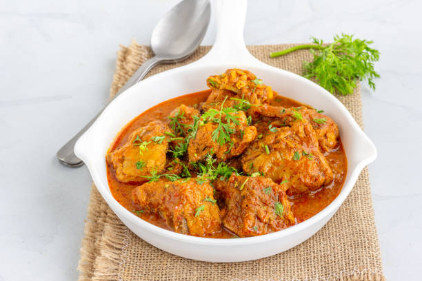 Chicken Curry in a Pant Garnished with Cilantro Indian Style Spicy Chicken Curry, Indian Food Photography chicken curry stock pictures, royalty-free photos & images