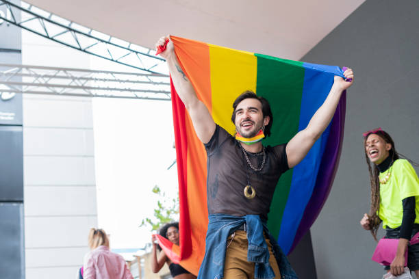 istock Young man proudly displaying the gay flag. 1323890692
