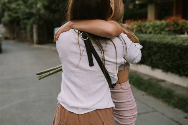 istock Two lesbian women walking down the street holding hands 1323892155
