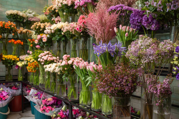istock Flower shop, various flowers in vases 1323893956