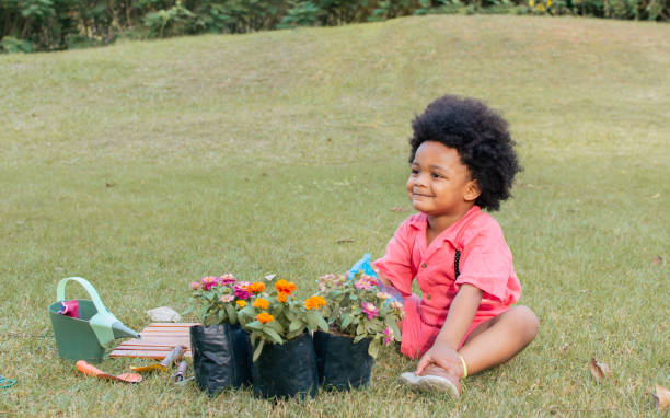 istock A little African boy playing in garden 1323896550