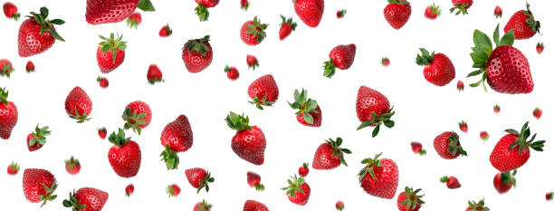 istock banner with many red fresh whole strawberries falling down above a white background 1323896796