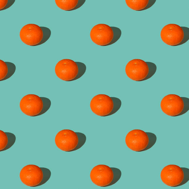 istock Trendy summer Seamless pattern of juicy orange grapefruit with shadow on pastel blue background. Minimal summer rest concept. 1323896808