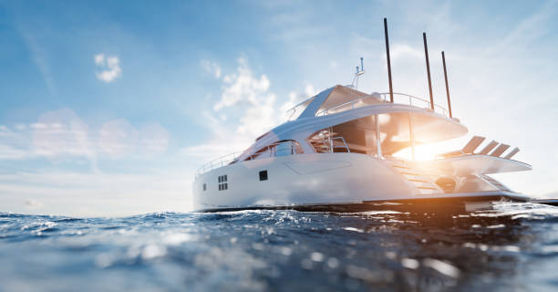 catamaran motor yacht on the ocean - recreatieboot stockfoto's en -beelden