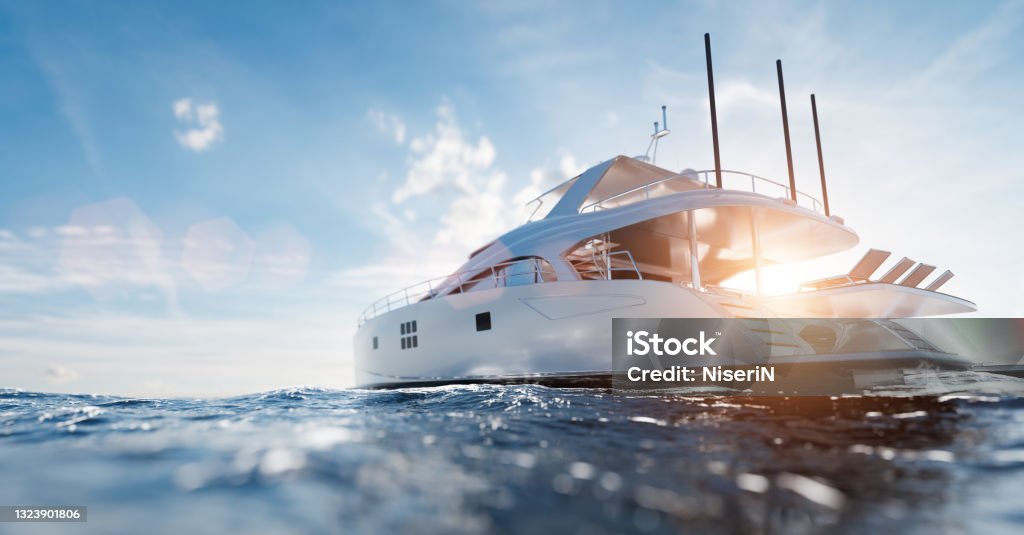 Catamaran motor yacht on the ocean Catamaran motor yacht on the ocean at sunny day Yacht Stock Photo