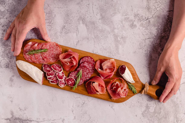 istock Serving board with a set of different meat snacks 1323904733
