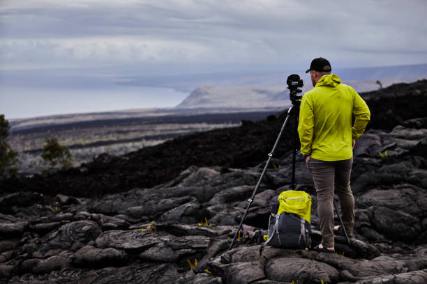 Hiker takes out his camera and tripod to shoot a time lapse