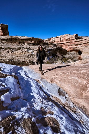 Sunshine melts patches of snow on surrounding desert landscape