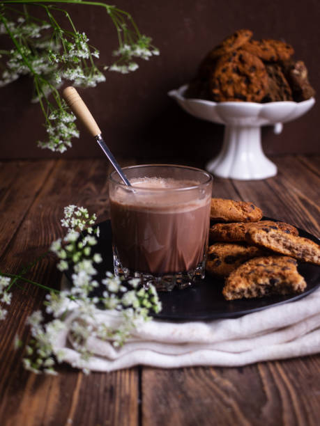 istock Chocolate drink with cookies on brown background 1323906975