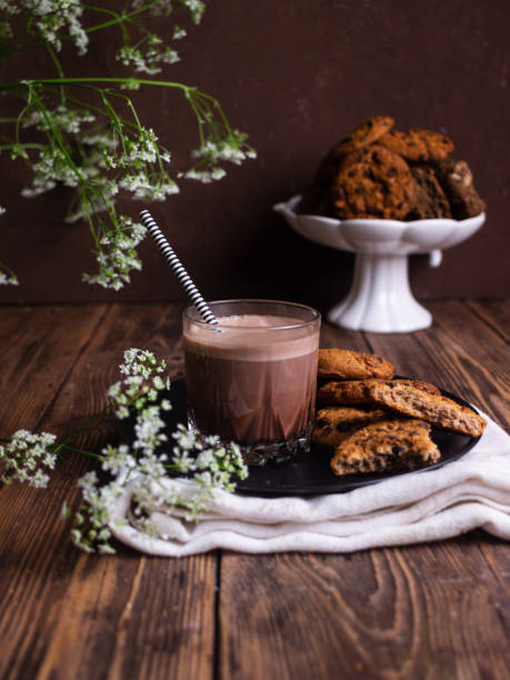 istock Chocolate drink with cookies on brown background 1323906978