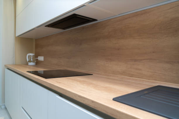 istock Modern kitchen interior with induction hob and faucet with sink 1323908491