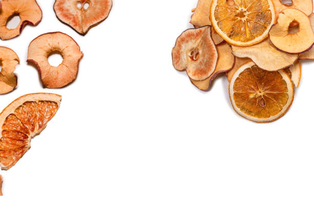 Dried fruit isolated on white background. Dried grapefruit, dried apple, dried pear slices.