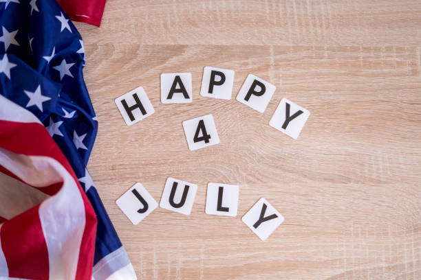 istock Light box with text HAPPY 4 JULY on a dark wooden background. 1323916011