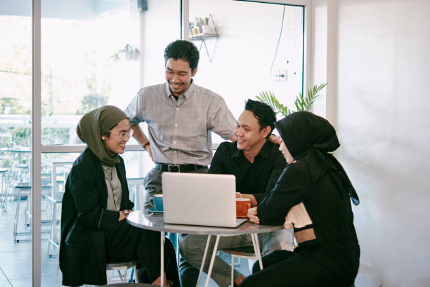 istock Group of Young People Having Discussion in Modern Coworking Space 1323917220
