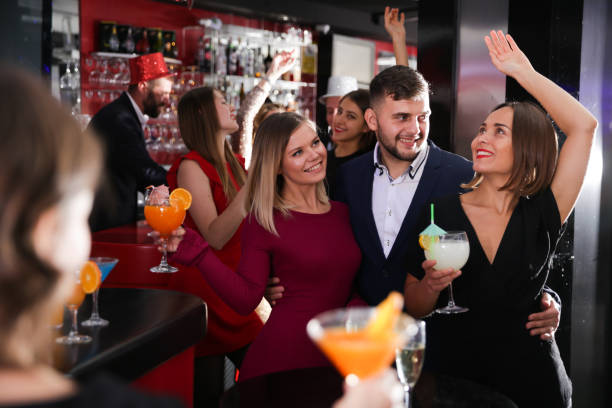 istock Guy with two girls partying in bar 1323917262