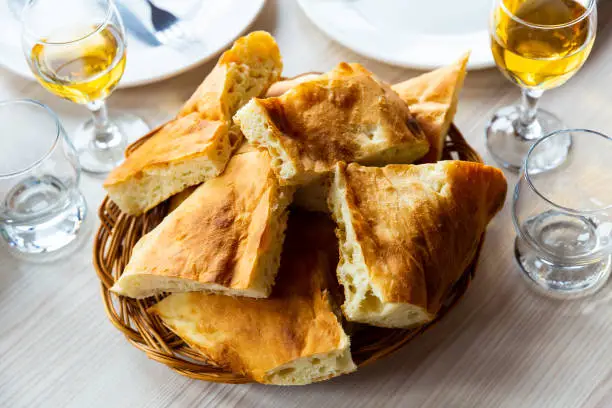 Photo of Slices of traditional Georgian bread shotis puri on dining table