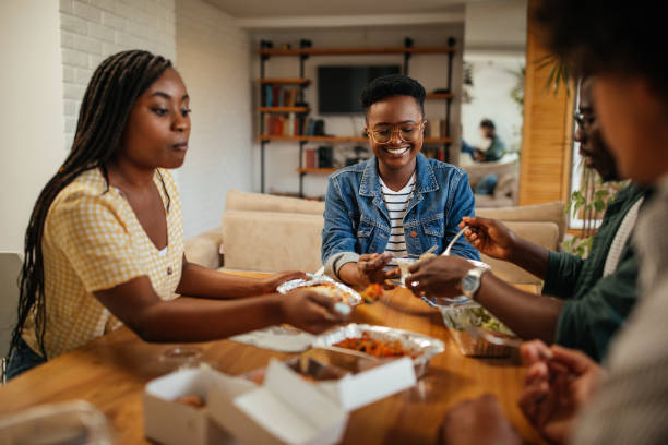 istock Delicious lunch break with friends at home 1323919107