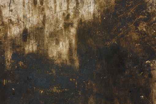 dirty oiled old black and gray plywood flat full frame backgound and texture.