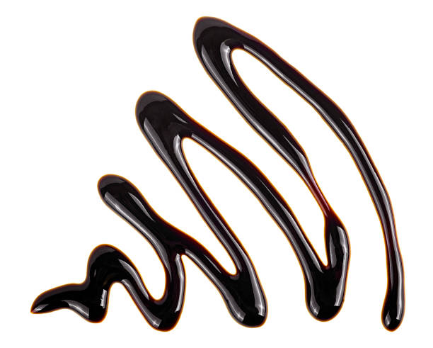 istock Chocolate sauce isolated on a white background. Chocolate syrup drop. 1323923802