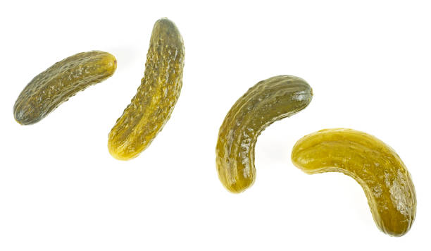 istock Delicious marinated pickled cucumbers isolated on a white background, top view. 1323923810