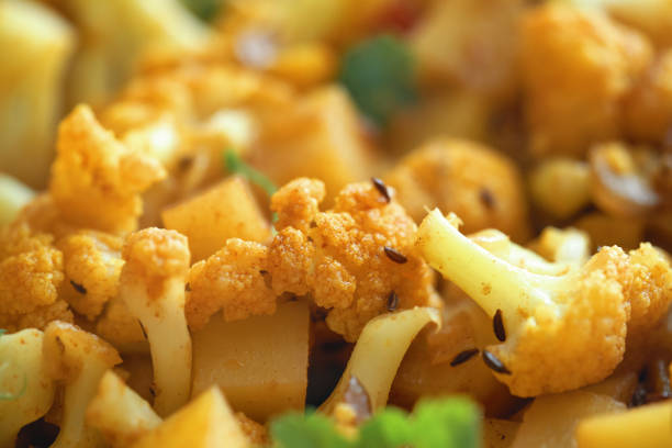 Indian Vegan Aloo Gobi Dish with Potatoes and Cauliflower