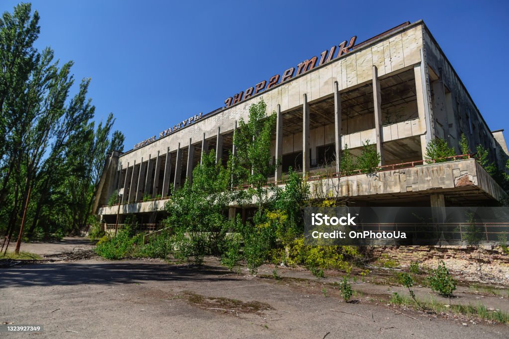 Palace of Culture ENERGIZER in abandoned ghost town of Pripyat, Chernobyl NPP alienation zone. Palace of Culture ENERGIZER in abandoned ghost town of Pripyat, Chernobyl NPP alienation zone. Inscription on building - Palace of Culture Energetic Abandoned Stock Photo
