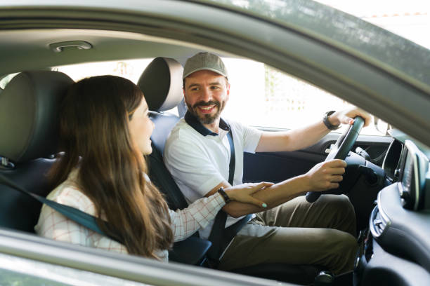 istock Girlfriend flirting with her partner on a car ride 1323927394