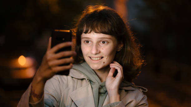 istock Woman taking a selfie 1323927414