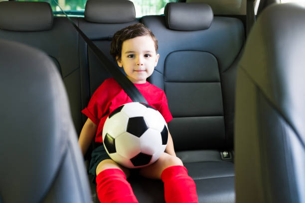 istock Adorable boy going home after playing soccer 1323927423