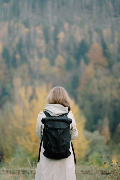 istock Woman walking in mountains 1323927440