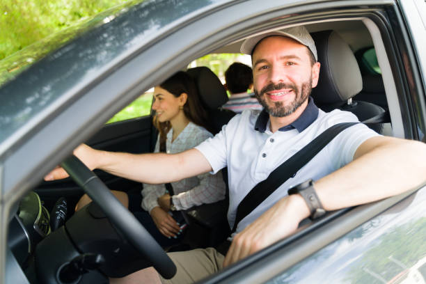 istock Cheerful husband enjoying a little road trip 1323927474
